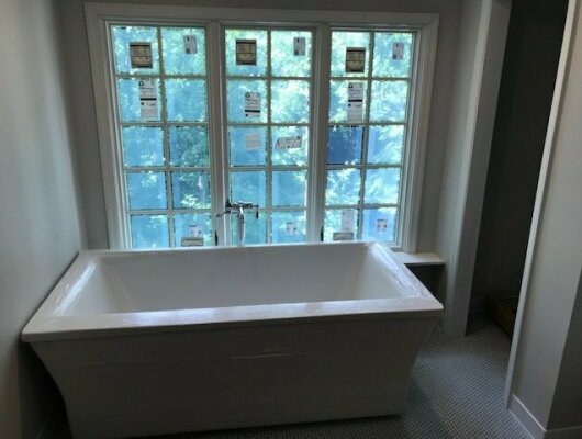 tub with windows behind