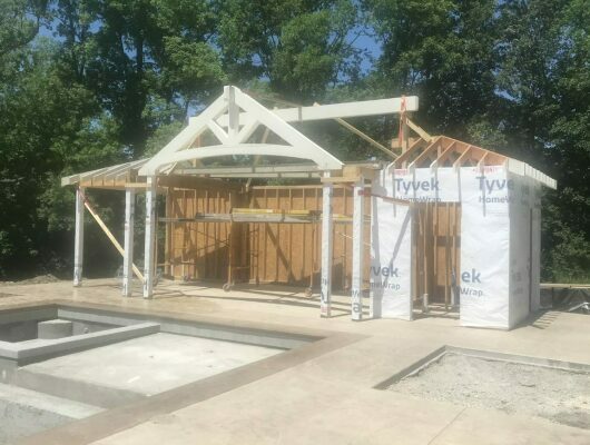 pool house framing with pool out front