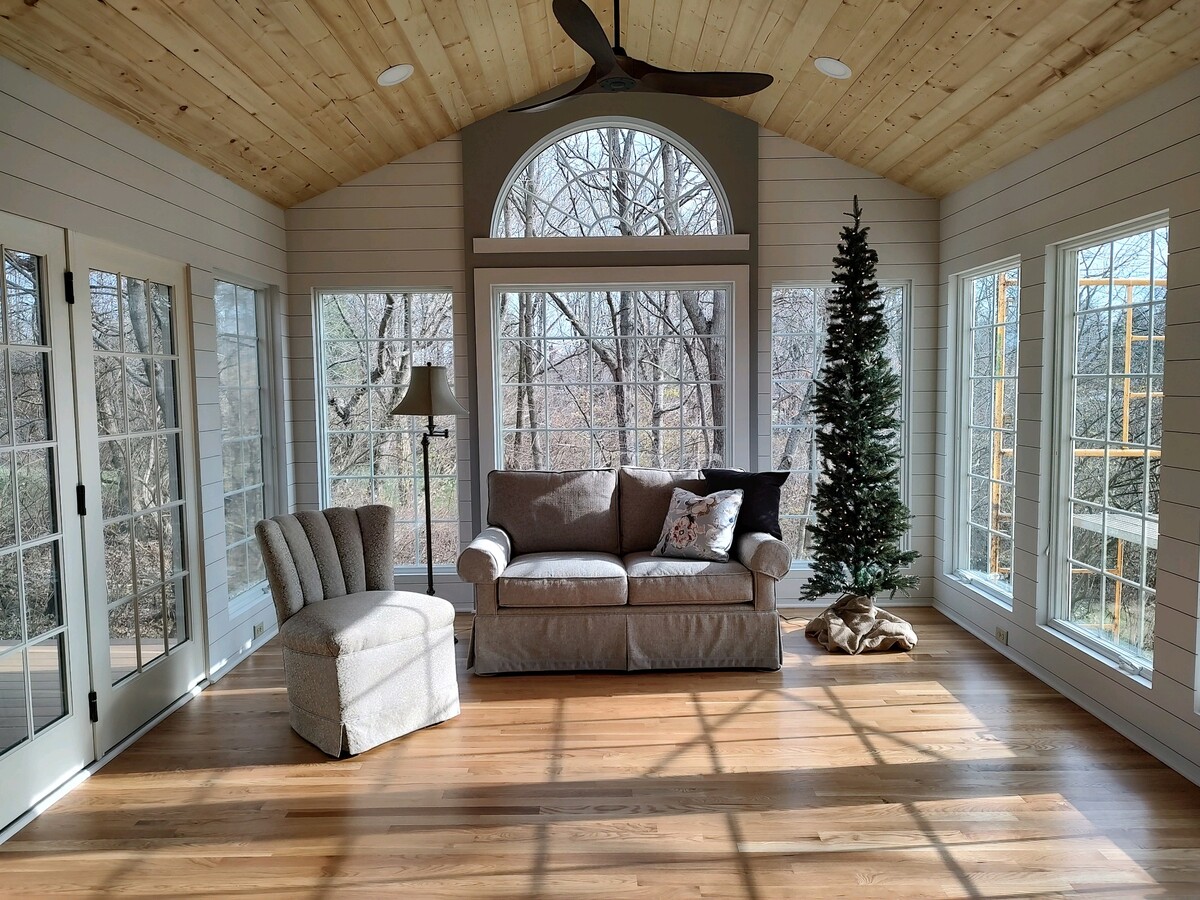 A sunroom with furniture