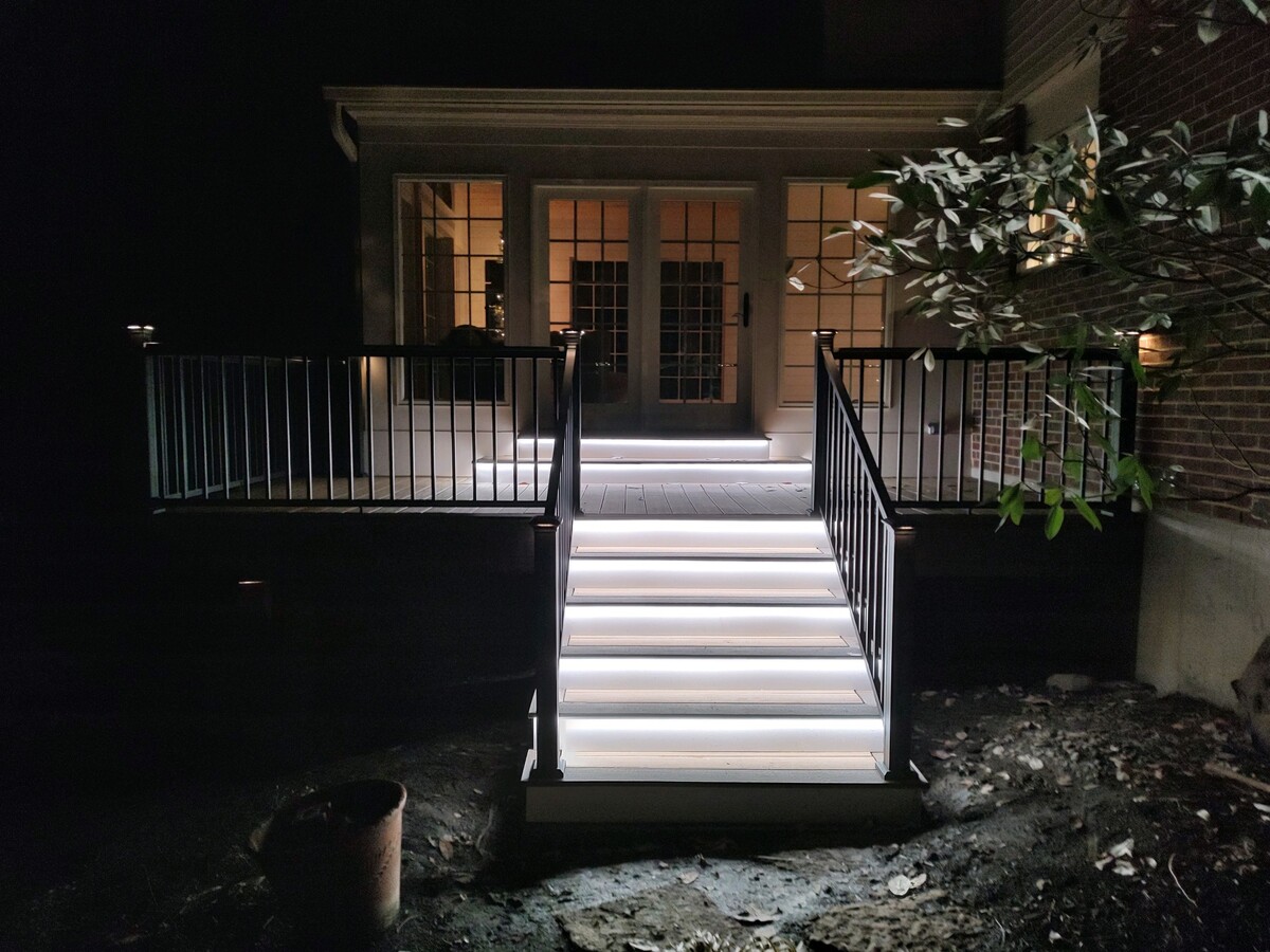 Porch with light up stairs at night