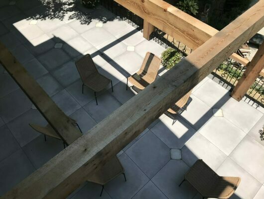 above view of patio with gray tile and chairs