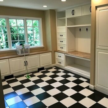 black and white floor tile with cabinets