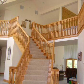 tan woods stairs with beige carpet