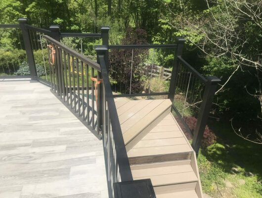 patio with black handrails and stairs