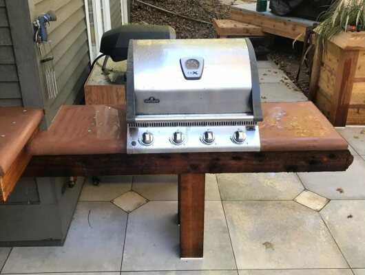 grill on wood stand