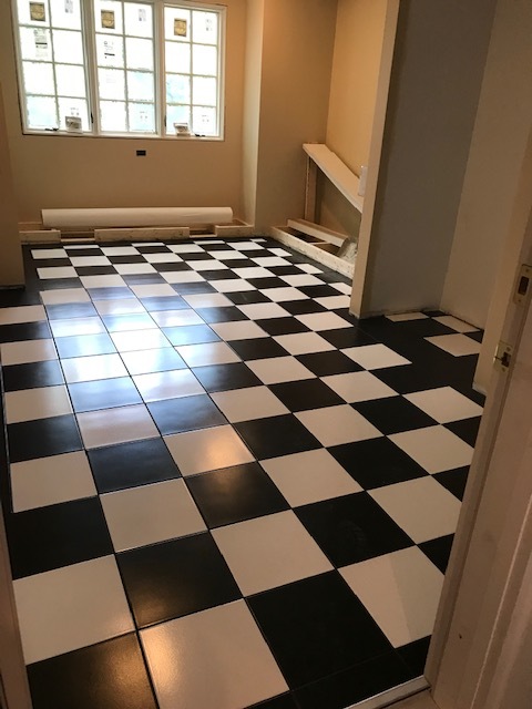 black and white floor tile with boards