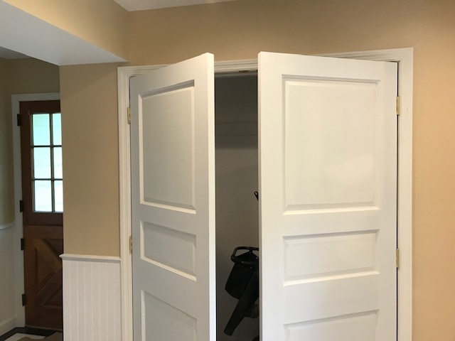 white doors opening to closet