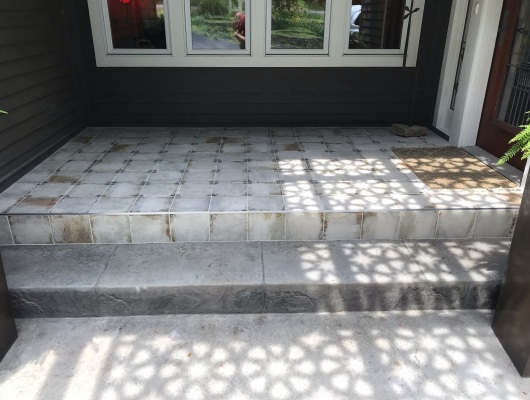 gray tile patio with blue flower design