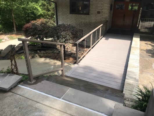 plank bridge with sidewalk and stairs