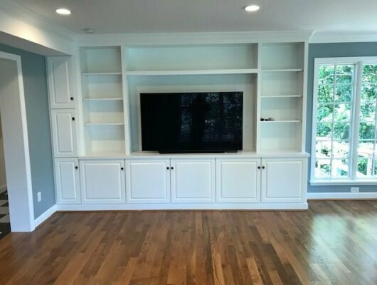 white entertainment center with tv