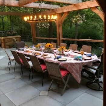 table with chandelier on patio