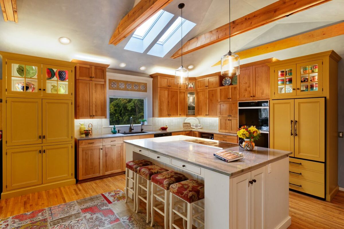 large kitchen with orange and browns